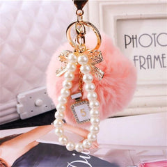 Unique Key Chain 2021 Pearl Crystal Bottle Bow Pompom Fluffy Puff Ball Keychains