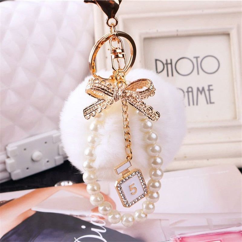 Unique Key Chain 2021 Pearl Crystal Bottle Bow Pompom Fluffy Puff Ball Keychains